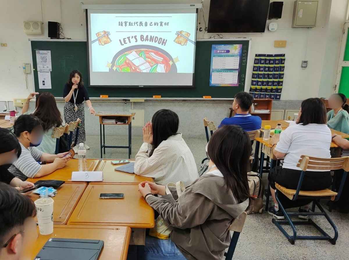 Participants listen as the facilitator explains the steps of a food-themed classroom activity using ingredient cards.