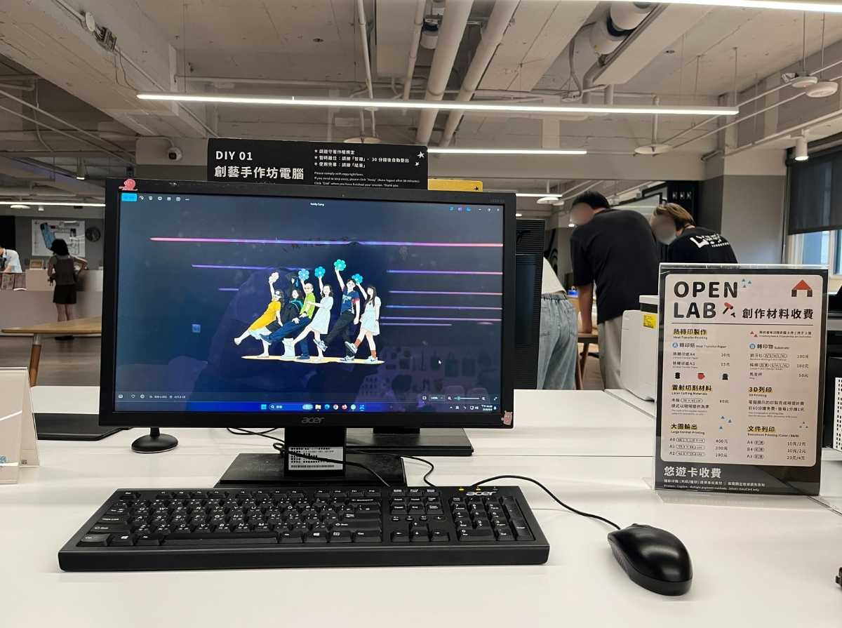 Computer station showing a family illustration file prepared for heat transfer printing.